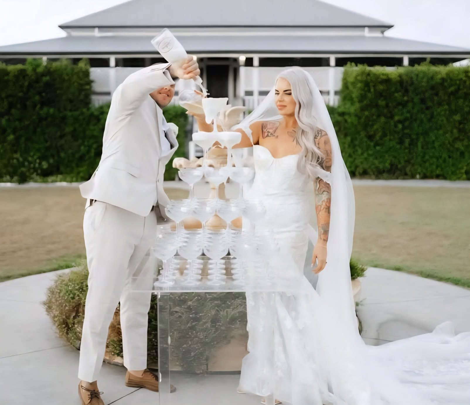 Bride and groom at a champagne tower